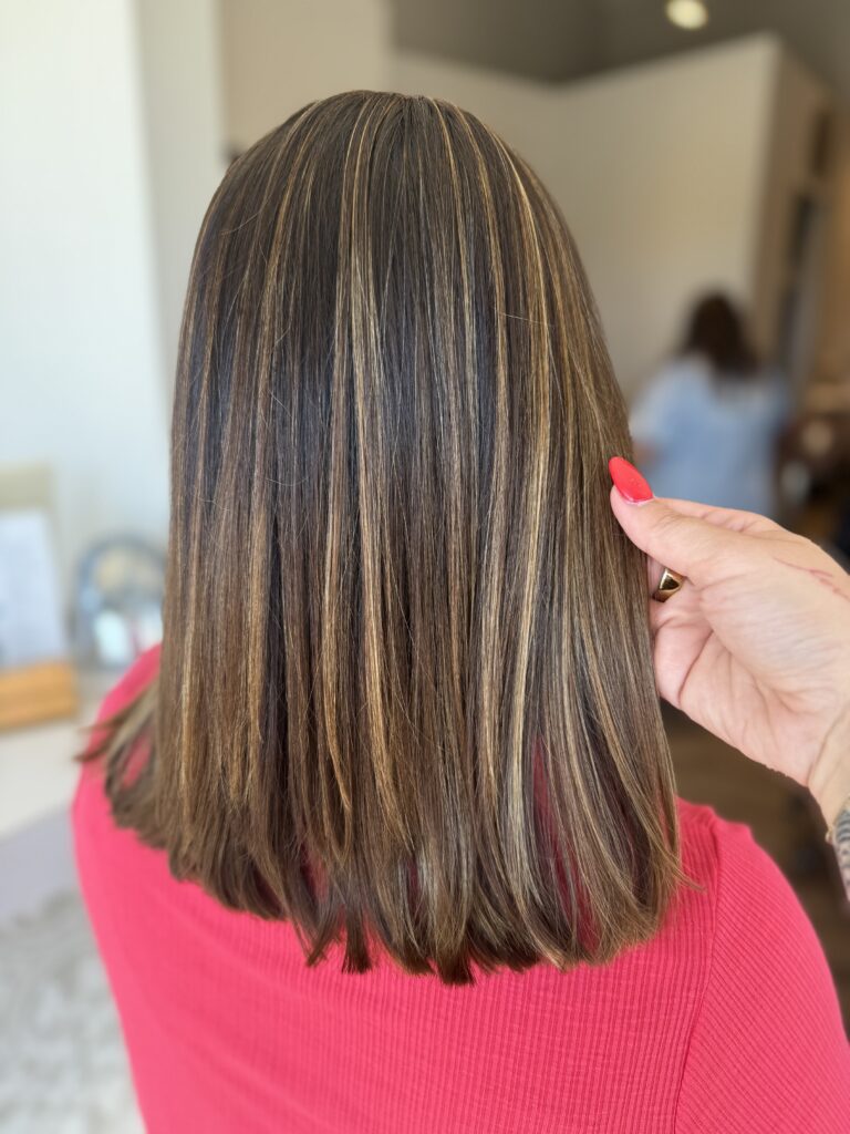 Dimensional color on long straight hair at Taylor Stevens Salon