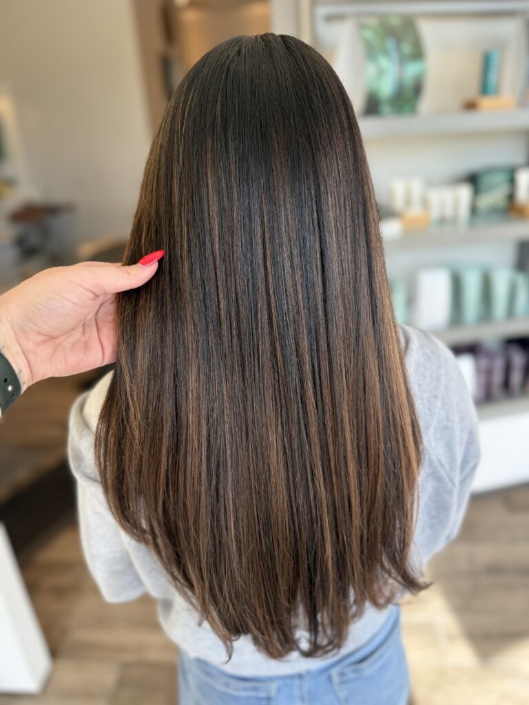 Sleek Brunette with Warm Highlights at Taylor Stevens Salon