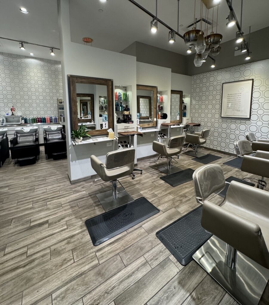 Styling chairs and shampoo stations inside Taylor Stevens Salon